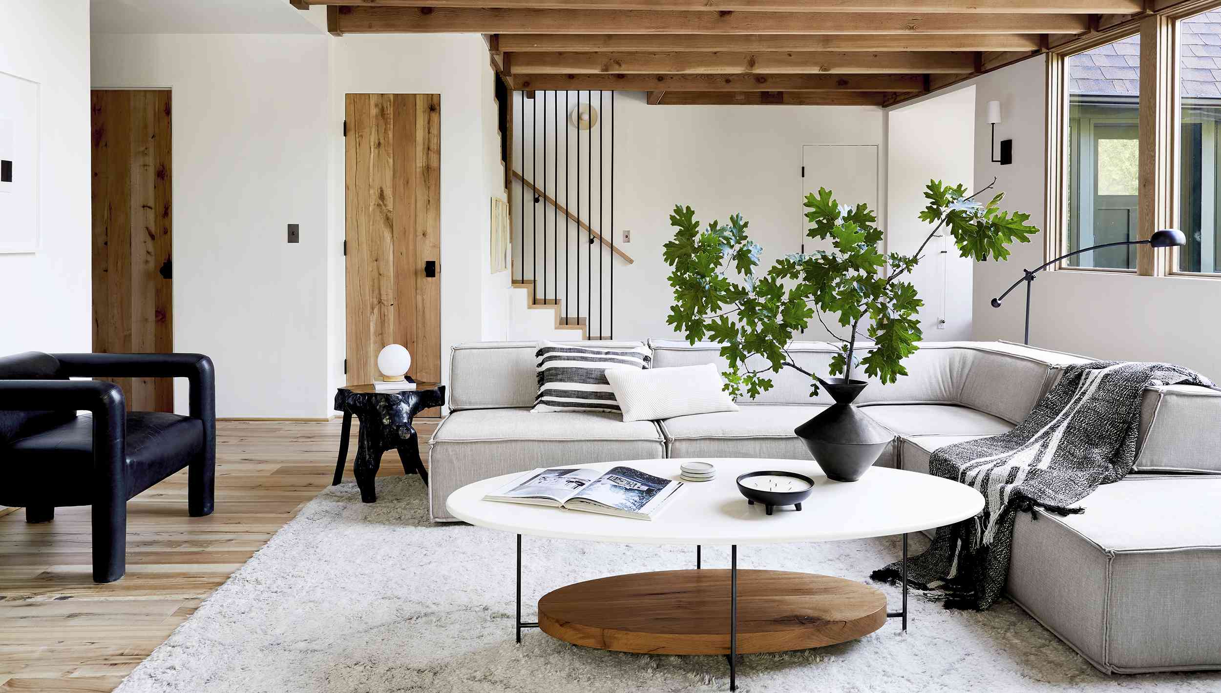 Refined mountain house living room with warm wood and natural light